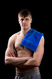 Young muscular man page with a blue towel