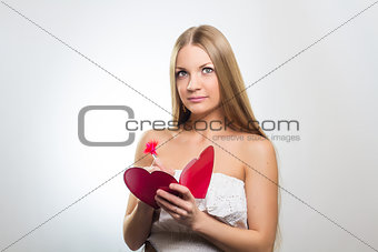 Woman holding Valentines Day heart sign 
