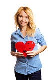 Attractive blonde girl holding red heart-shape