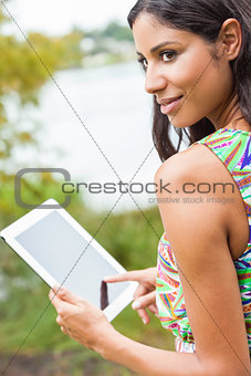 Mixed Race Latina Woman Using Tablet Computer