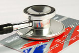 A stethoscope on the credit card concepts of checking the financial health and security