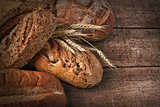 Assortment of loaves of bread on wood