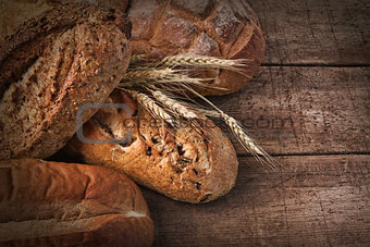 Assortment of loaves of bread on wood