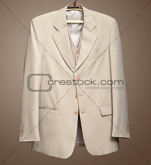 Beige jacket on hanger with Clipping path