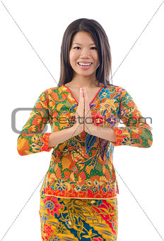 Southeast Asian female greeting 