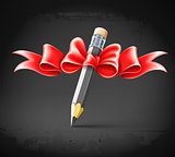 pencil decorated by bow on grunge background