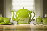 Green teapot and teacups