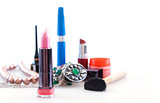 brightly colored makeup objects on white background