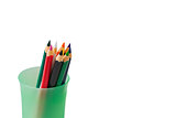 colored pencils for children in green glass