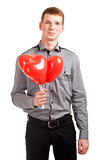 Portrait of a young man with balloons