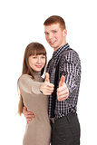 Happy couple gesturing thumbs up sign