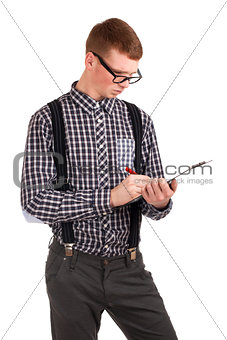 Young man writing in clip board