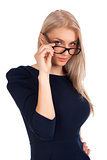 Young woman looking at you over glasses