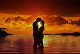 Couple at beach under sunset