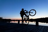 Silhouette of a Cyclist on the Sunset Sky