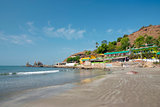 deserted beach with huts in Goa, India