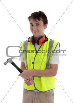 Young teen apprentice builder holding hammer