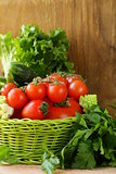 frame of vegetables (cucumber, tomato,mushrooms, garlic)  on a wooden background