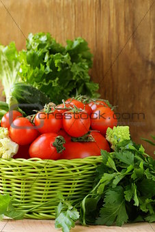 frame of vegetables (cucumber, tomato,mushrooms, garlic)  on a wooden background