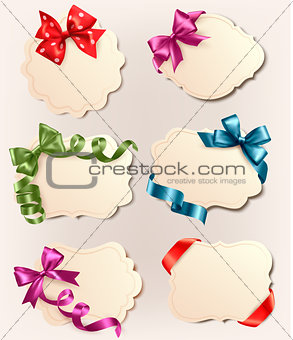 Set of beautiful retro labels with red gift bows with ribbons. Vector illustration.