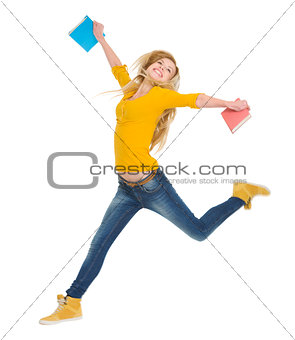 Happy student girl with books jumping