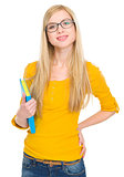 Portrait of happy student girl in glasses with book