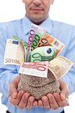 Businessman hands with euro banknotes in a money bag