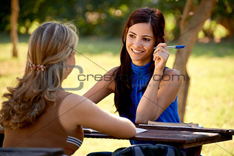 Young college students talking and studying for university exam