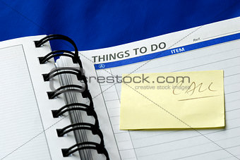 “To Do List” on the day planner isolated on blue
