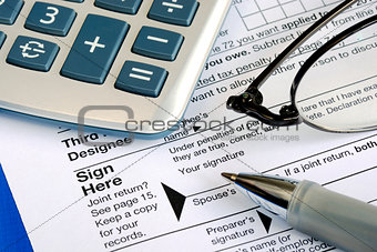 Complete and sign the income tax return isolated on blue