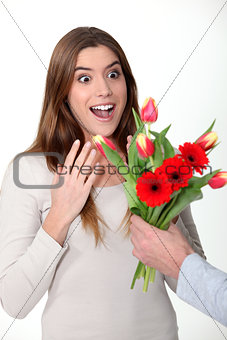 Woman receiving bouquet of flowers