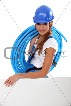 Young brunette with helmet and blue tube roll