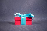 red gift box with cyan bow
