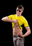 Young man showing the abdominal muscles  
