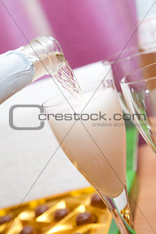 pouring champagne