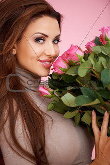 Beautiful seductive woman with roses