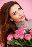 Beautiful smiling woman with roses