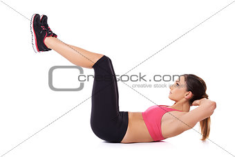 Fit woman exercising her abdominal muscles