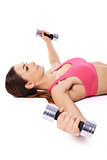 Woman working out using dumbbells