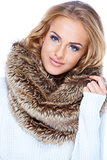Gorgeous blond woman wearing fur scarf and smiling