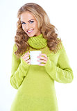 Blond woman holding cup of hot drink