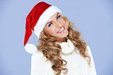 Smiling blond woman in Santa hat isolated