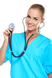 Pretty young doctor holding her stethoscope while isolated