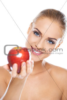 Smiling beauty holding red apple