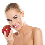 Cute young lady holding red apple