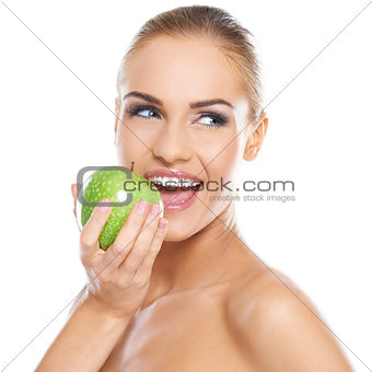 Smiling beauty holding green apple