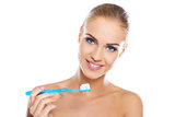 Closeup portrait of a woman brushing her teeth