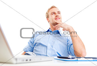 young man at office daydreaming