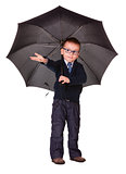 Boy in black clothes standing under umbrella