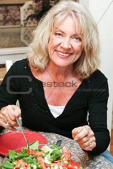 Healthy Middle-aged Woman Eating Salad